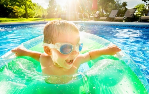 Image may include: kid, pool, water safety, summer