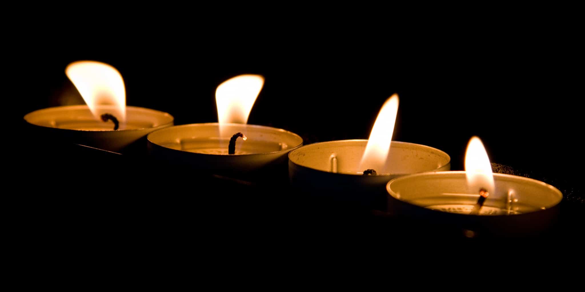 Candles in a piece on holiday depression in Birmingham, and where to turn for support for loneliness, crisis, or suicidal thoughts. Plus, a Blue Christmas service.