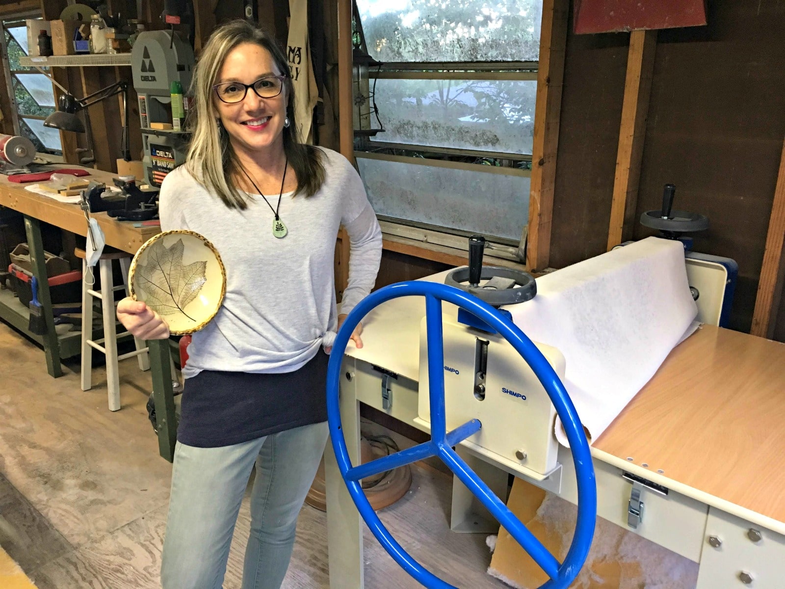 Shelleigh Buckingham, one of the Roebuck Springs potters, by her slab roller. 