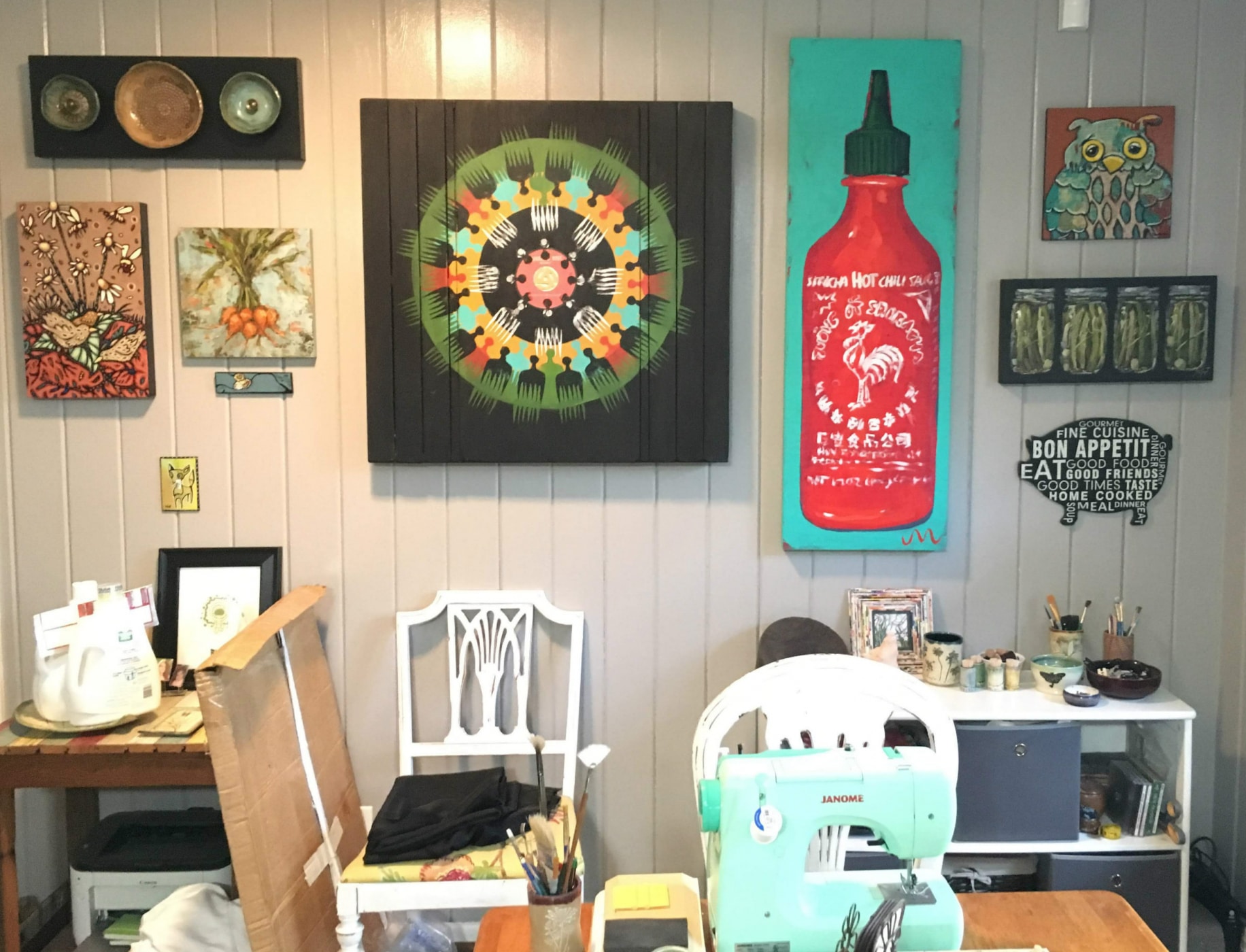 Shelleigh Buckingham, one of the Roebuck Springs potters, has several art walls in her home that feature the work of local Birmingham artists. 