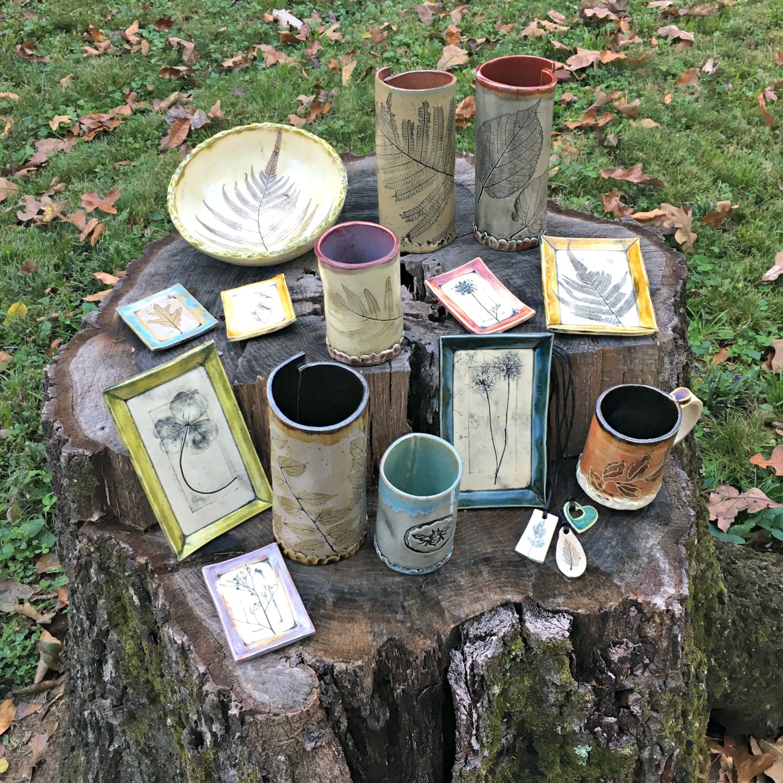 One of the Roebuck Springs potters, Shelleigh Buckingham, displayed selected works in her back yard where she finds leaves to press into the clay. 