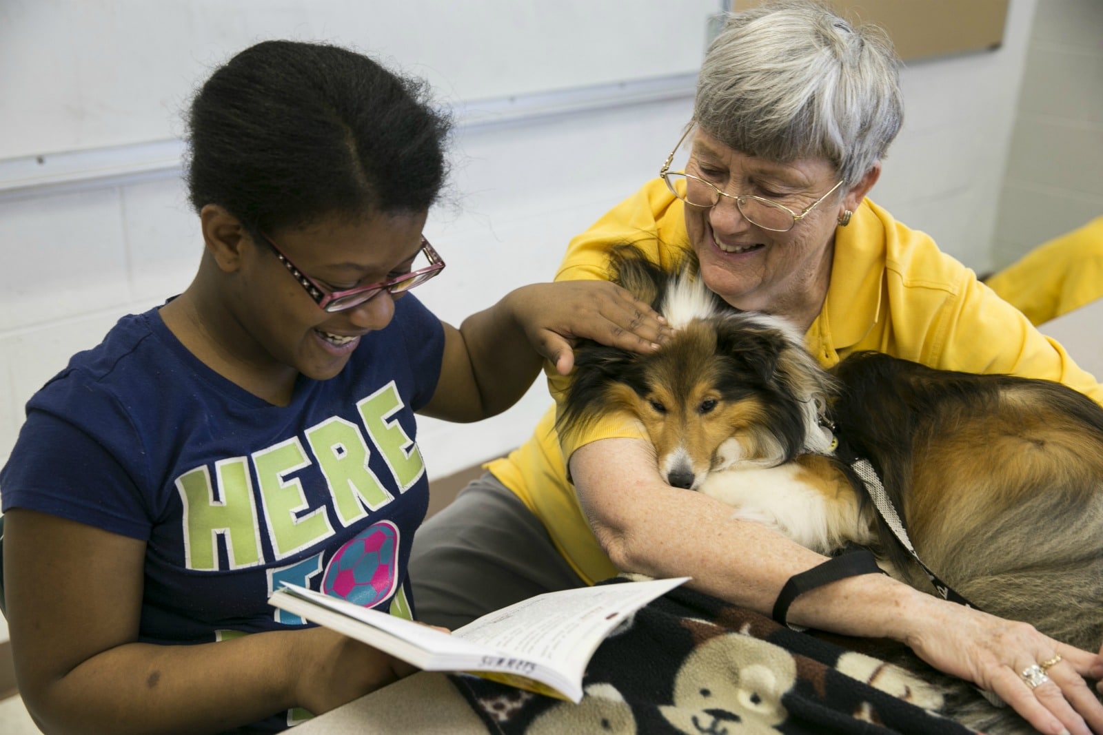 With Animal-Assisted Therapy, Hand in Paw helps young people learn to read