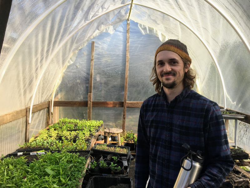 Trevor in a greenhouse used for indoor herb growing