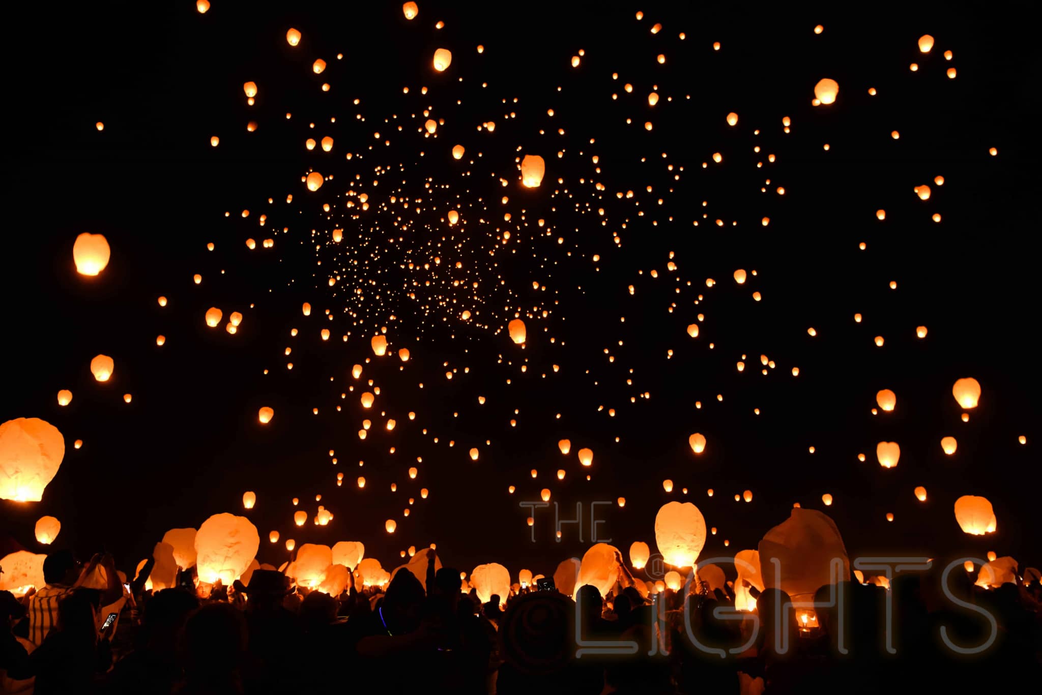 Thousands of lanterns are released into the air in unison with the personal wishes, dreams and goals of festival-goers below written on them. (Photo via The Lights Fest)
