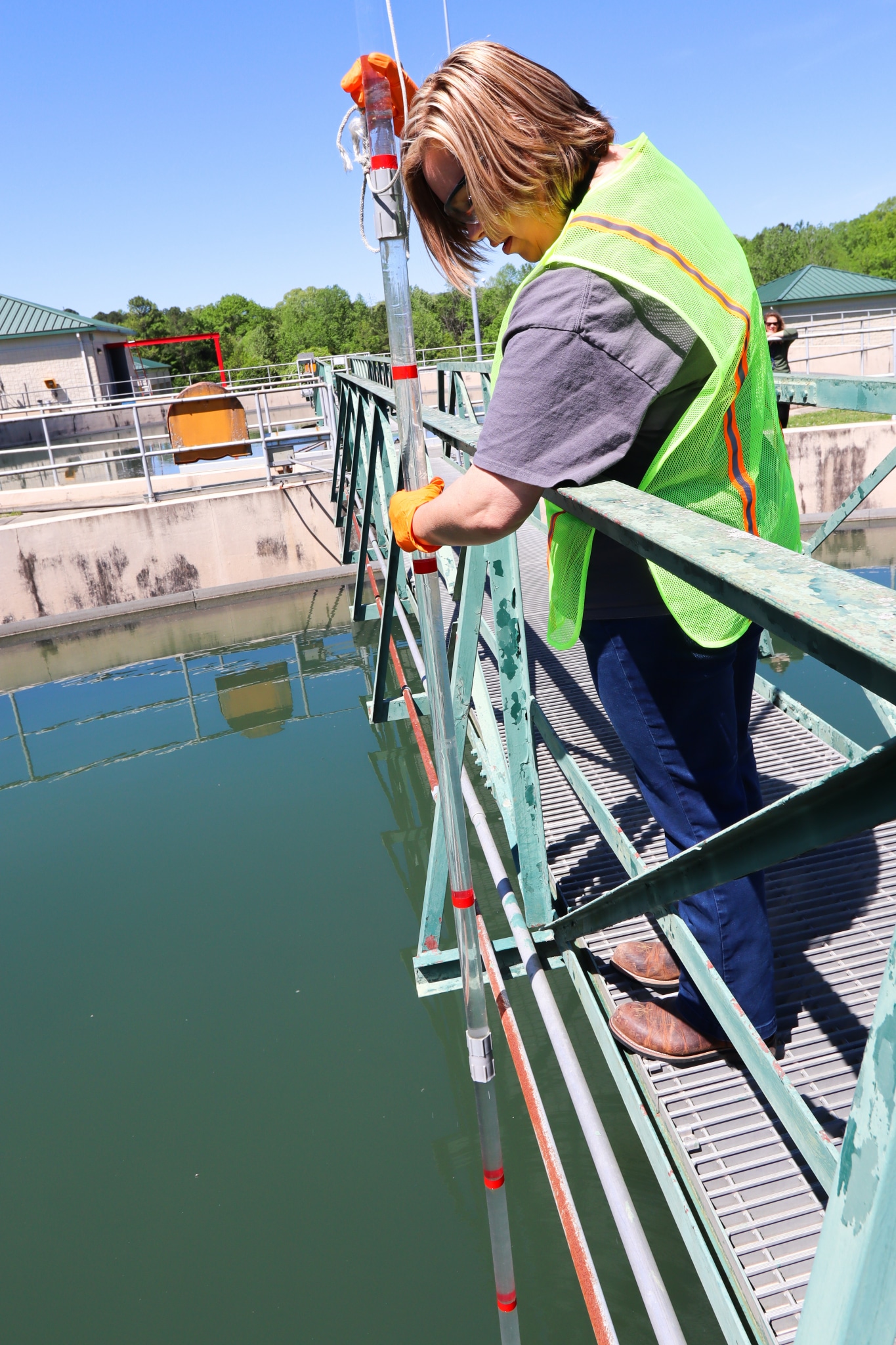 White at the Leeds location checking levels of solid materials that have settled to the bottom of a clarifier. Photo by Christine Hull for Bham Now