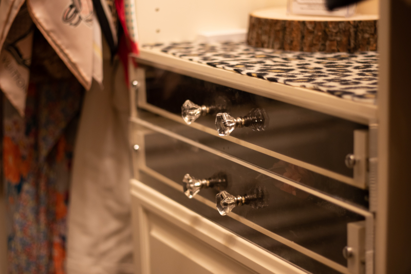 See-through drawer fronts are so pretty in this Closets by Design designer closet.