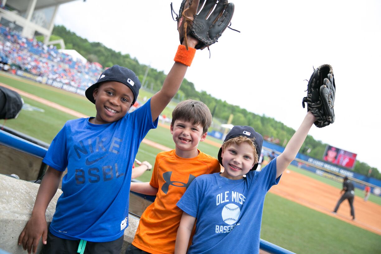 The tournament is a perfect place to bring your baseball loving kiddos! Be sure to pack their gloves for some foul ball catching. Photo via SEC Baseball Tournament