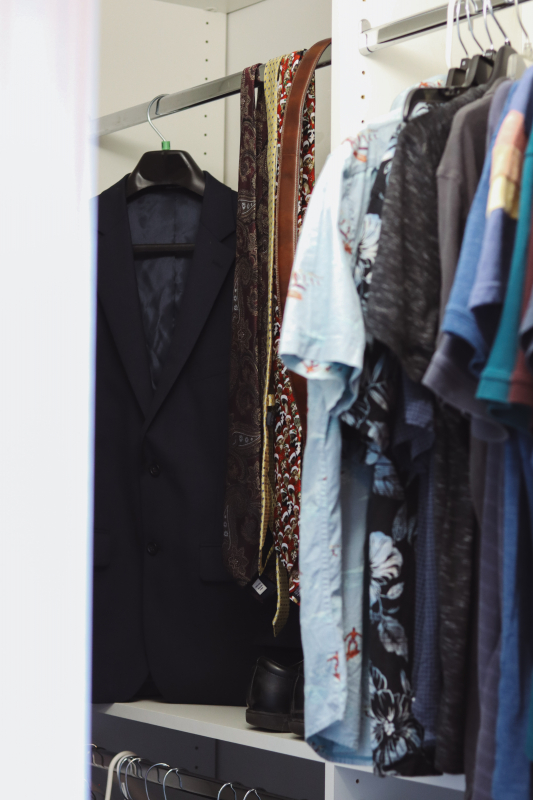 Closets by Design helped create an organized bedroom closet for a teenager with man-sized clothes. 