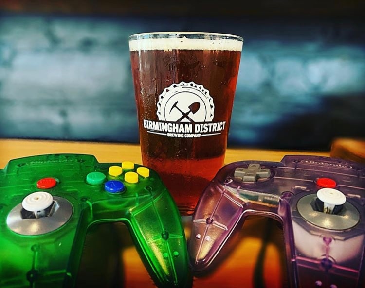 New Birmingham Beer called Birmingham Tea Party by Birmingham District Brewing, next to two Nintendo 64 controllers