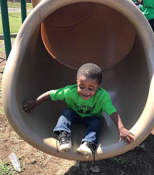 Child Laughs in a Slide