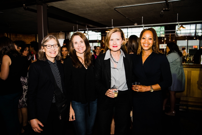 A group of four women pose and smile together at Smart Party 2018.