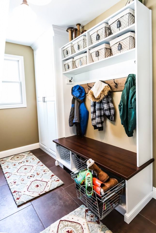 A mudroom by Closets by Design gives everyone their own space