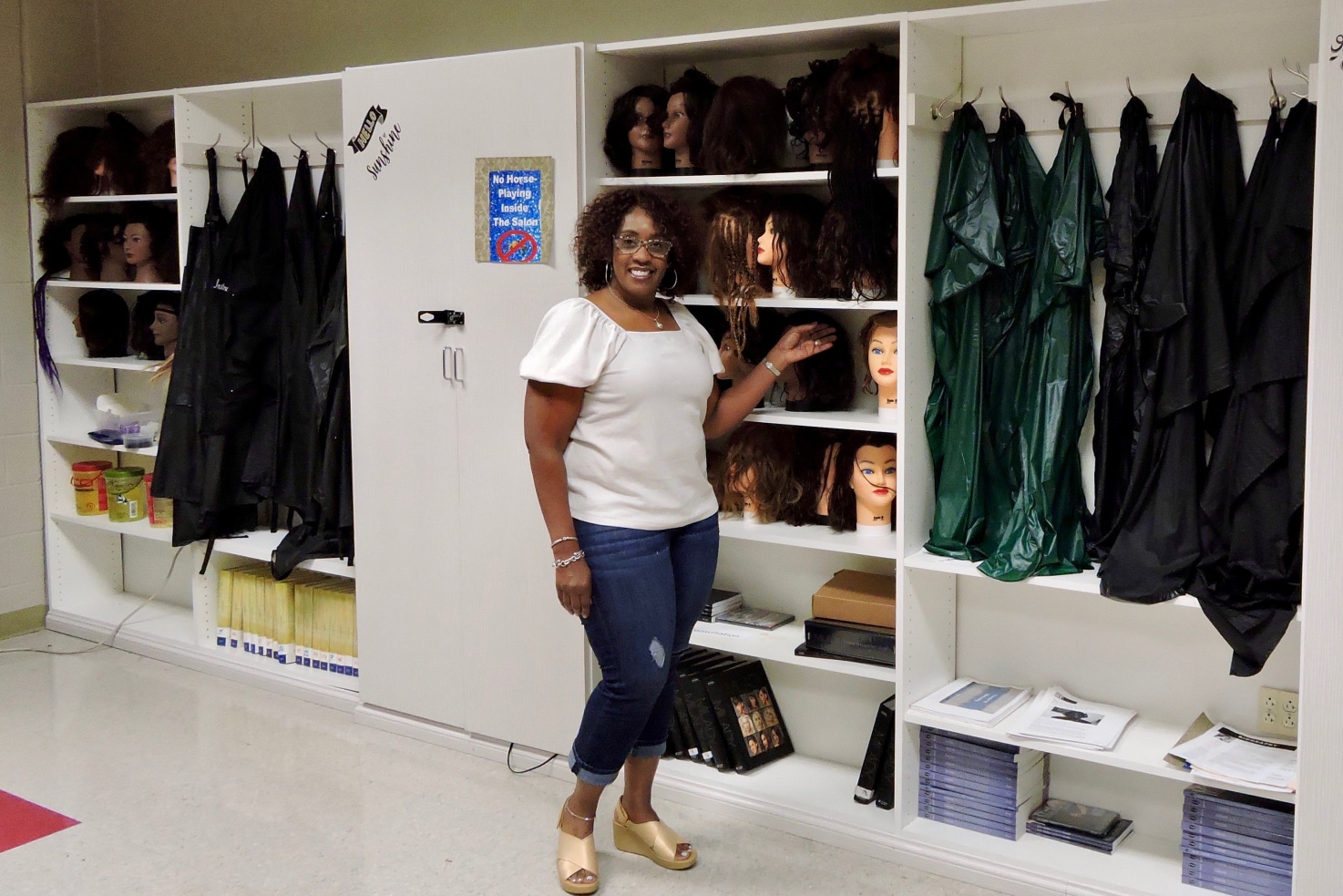 Sonya Pitts next to her new closets at Carver High School