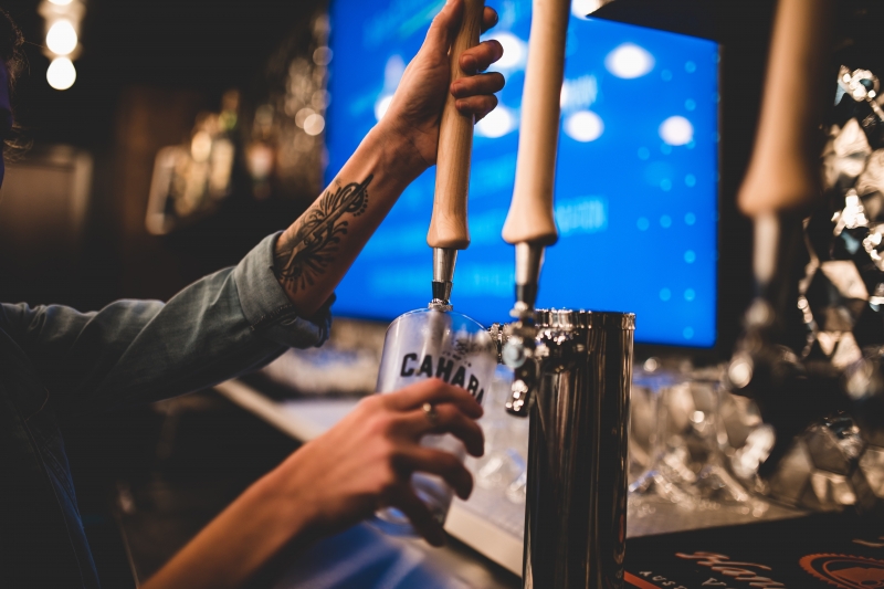3 things you may not know about Birmingham's Sidewalk Film Center & Cinema at The Pizitz (GIVEAWAY) 3 A bartender pulls a draft of Cahaba Beer.