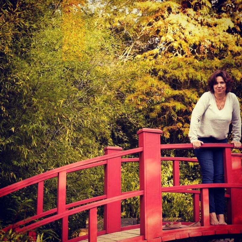 Woman poses on bridge