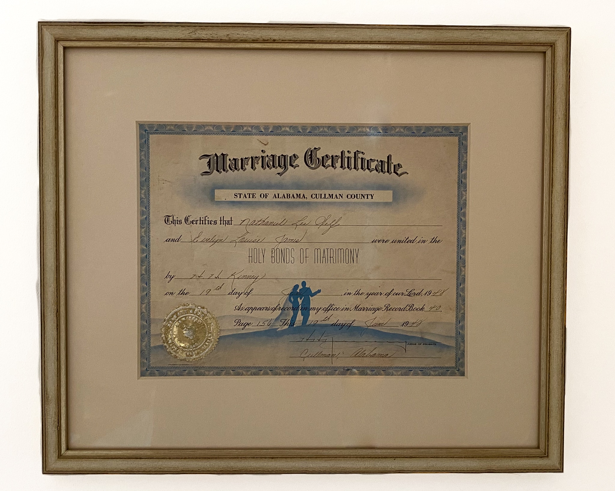 The finished product of a restored wedding certificate. It is framed and matted.