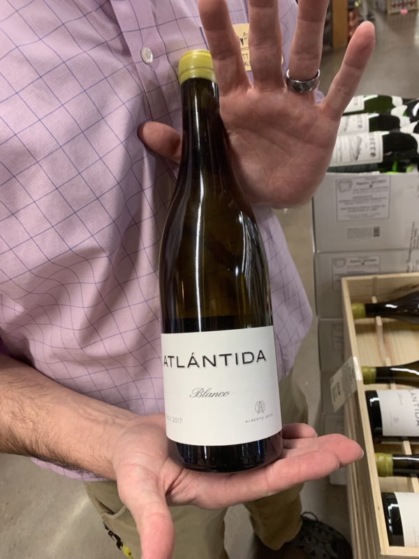 A Birmingham wine expert holds a bottle of Atlántida Blanco.
