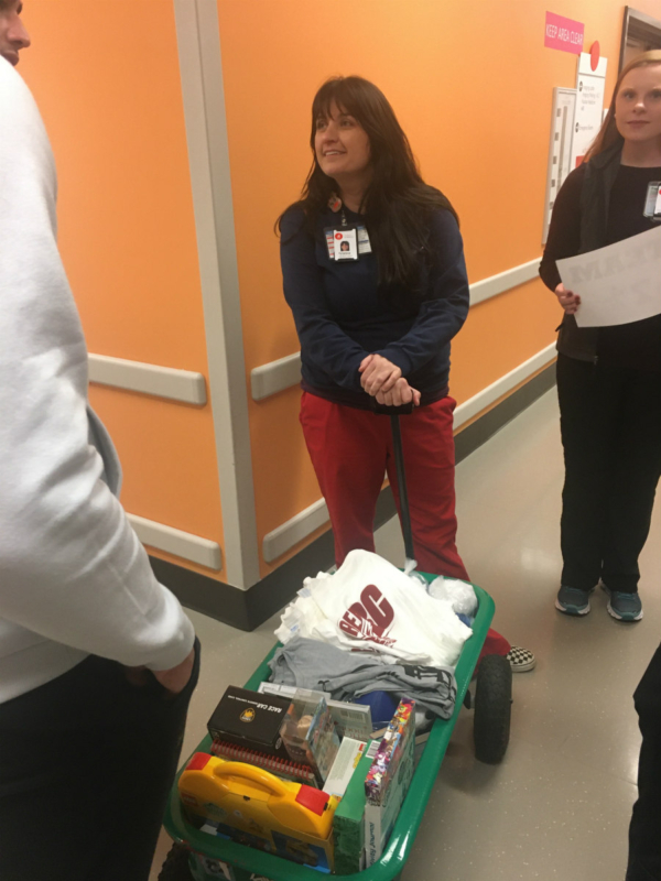 Gifts and visits from football players at Children's of Alabama