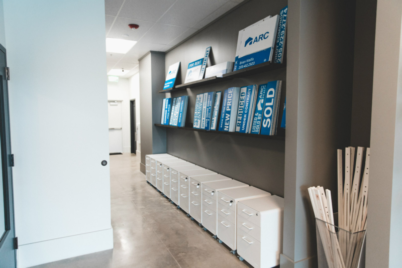 Signs and file cabinets at ARC Realty