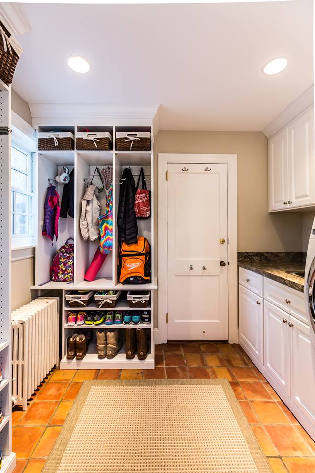 an organized mudroom where kids and family members can put all their things