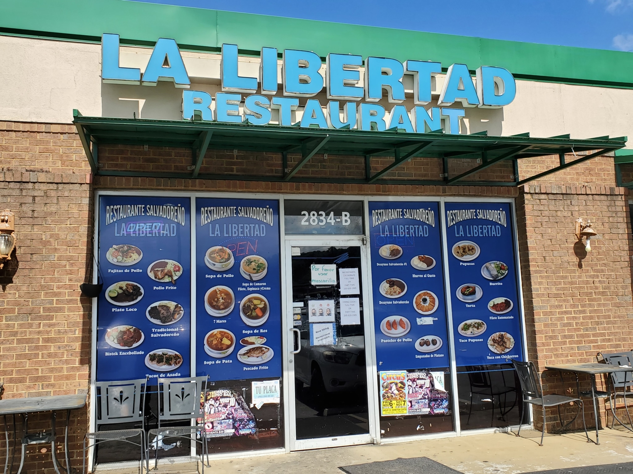La Libertad storefront with pictures of menu items