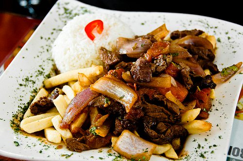 Photo of stir fried steak with french fries and white rice