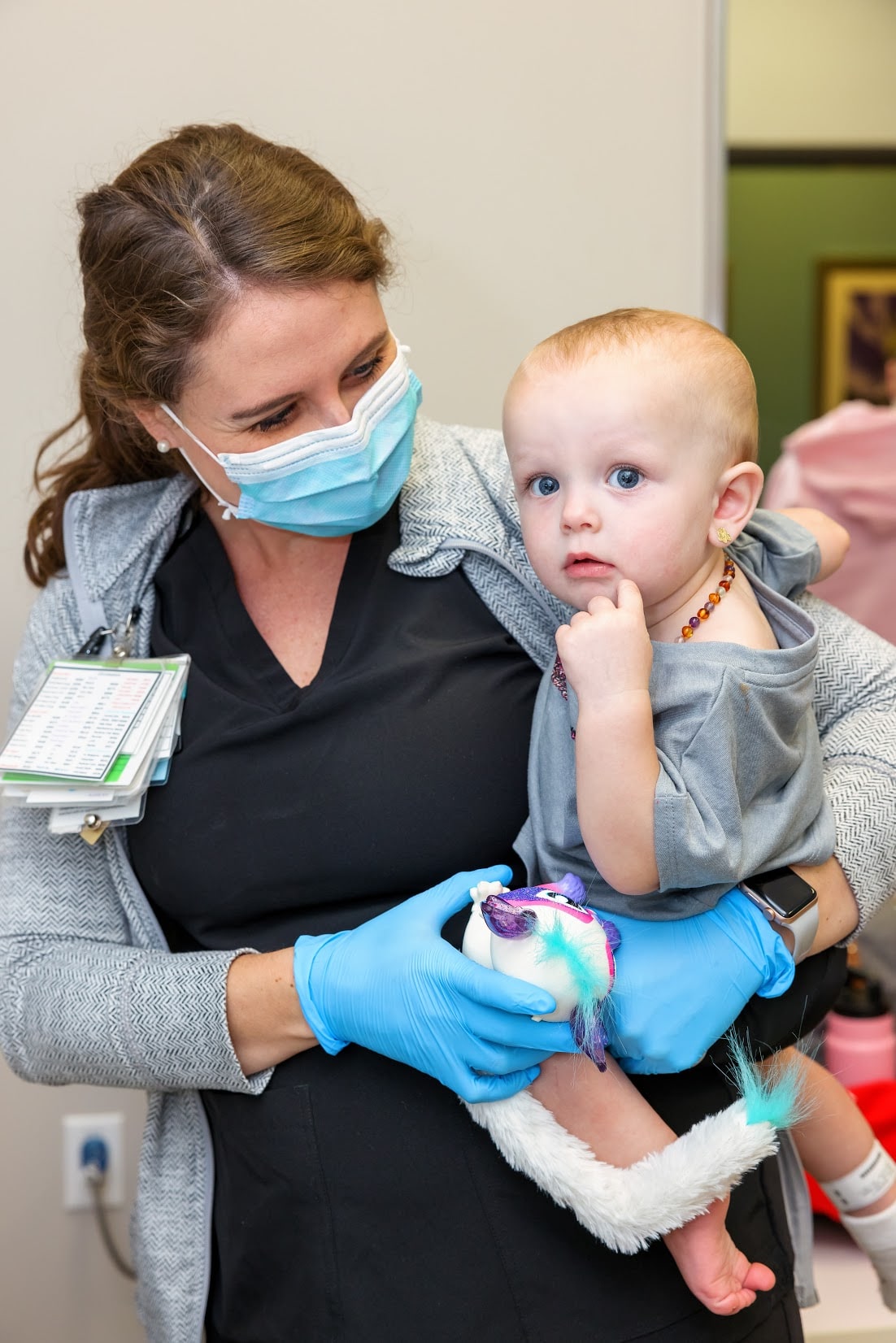 A nurse at Children's of Alabama with a young patient