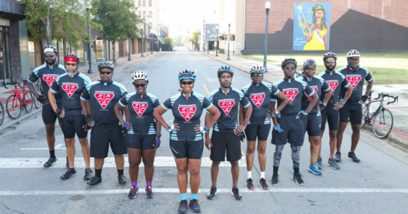 Black People Run, Bike, and Swim standing together for a group photo