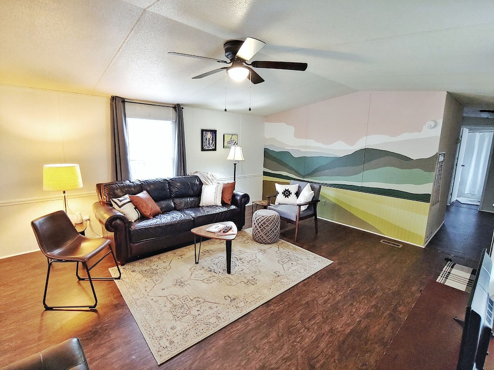 Living room with mural in Tin Can Home 