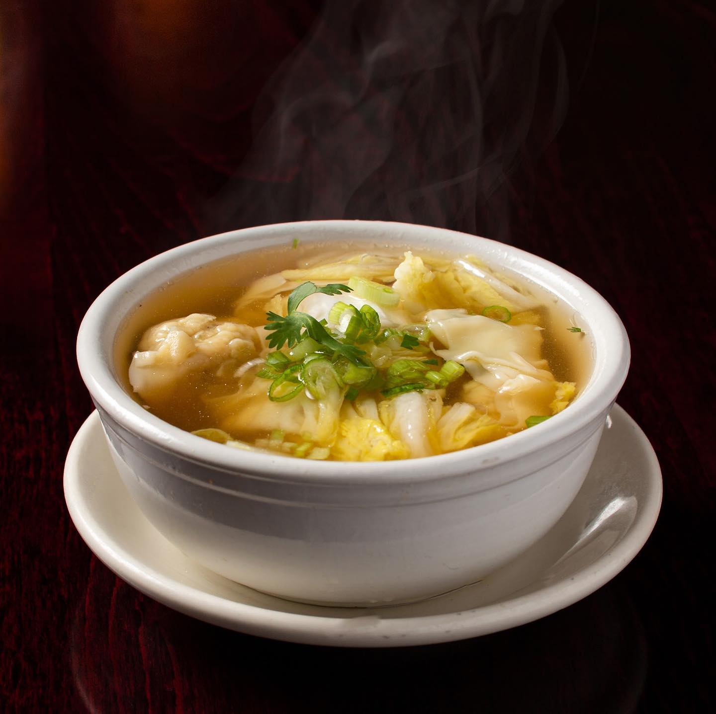 Bowl of hot dumpling soup