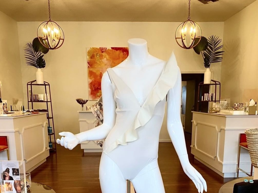 Mannequin wearing a white swimsuit at Beaute Therapie - Birmingham swimwear