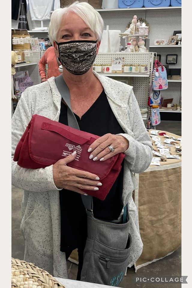 Local shopper picks out purse at Village Pharmacy