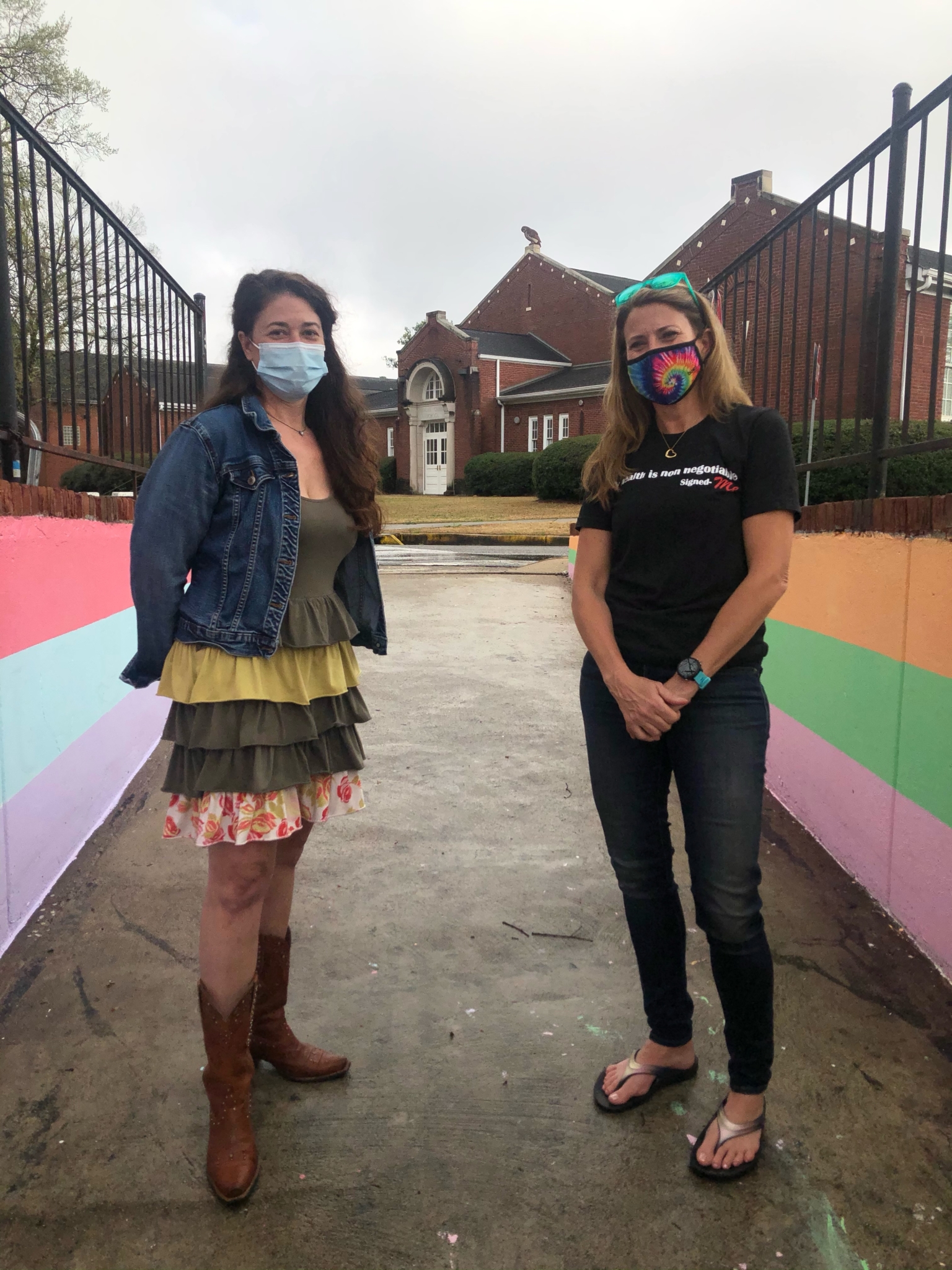 Lisa Holland and Jennifer Andress at the entrance to the tunnel where the Shades Cahaba mural is