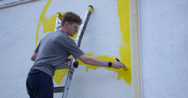 Local artist Jonathan Edwards paints in bright colors. Photo by Libby Foster for Bham Now.
