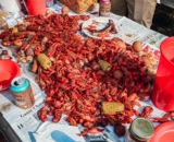 crawfish boil on a newspaper covered table