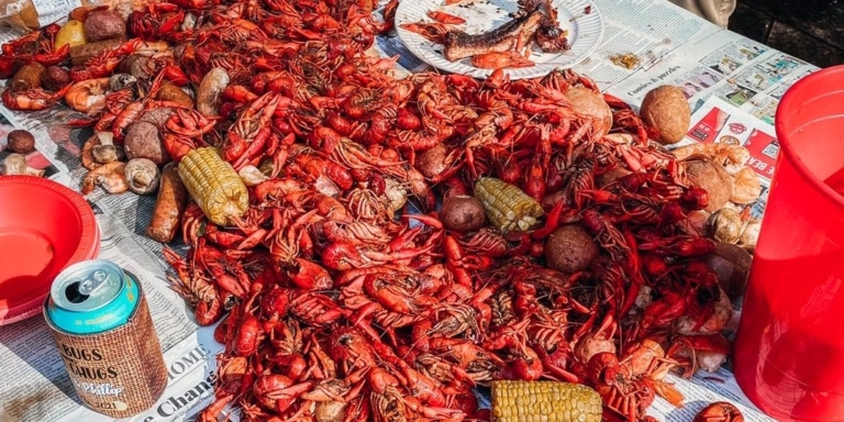 crawfish boil on a newspaper covered table
