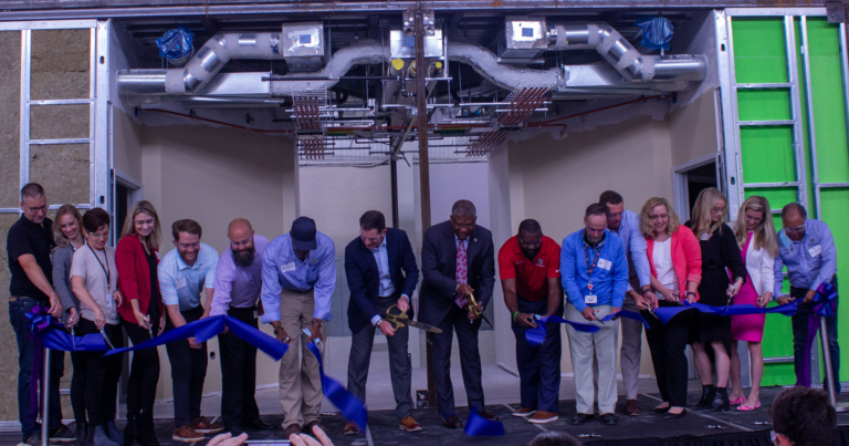 Blox and Encompass Health employees cut the ribbon to begin their new partnership! Photo by Libby Foster for Bham Now.