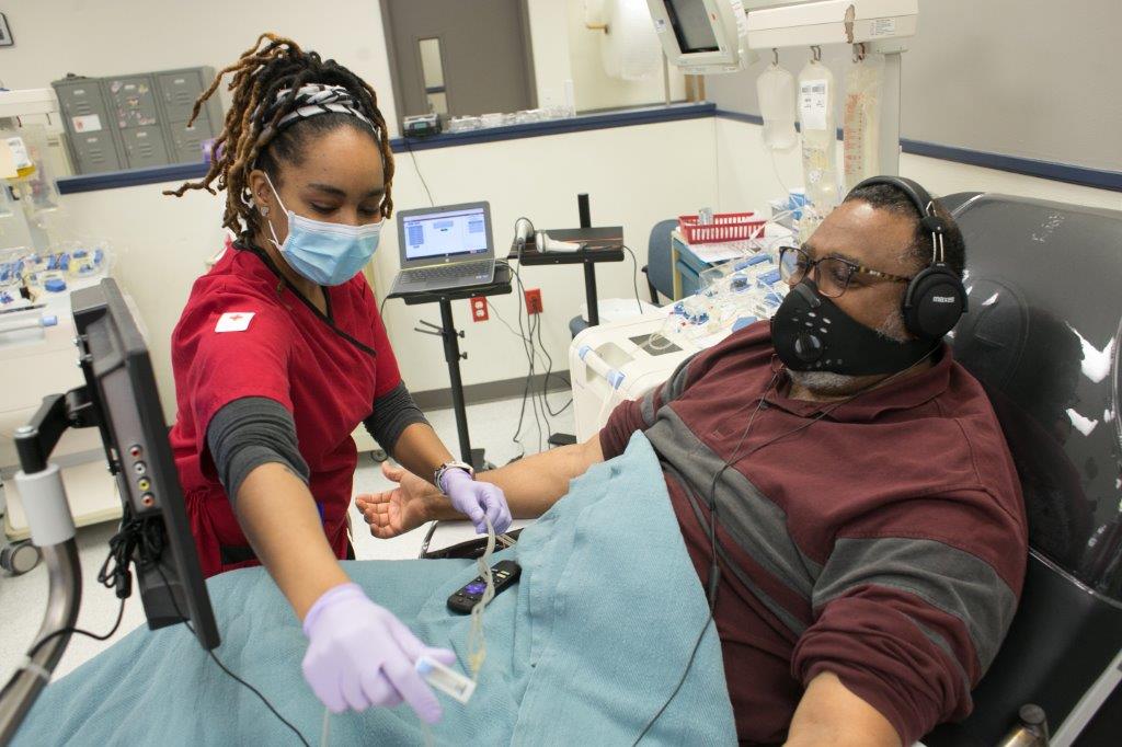 The American Red Cross is in desperate need of blood donations! 3 Man donates blood to the American red cross