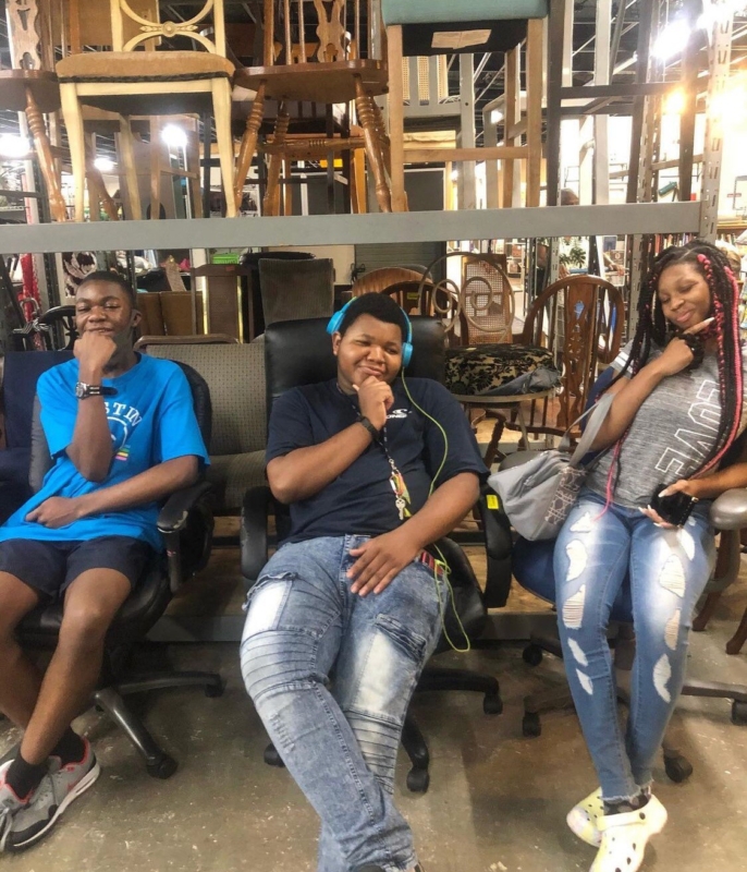Sozo Trading Co. partners with WE Inc. to provide job training for young adults 2 Three students sit down and pose at Sozo Trading Company