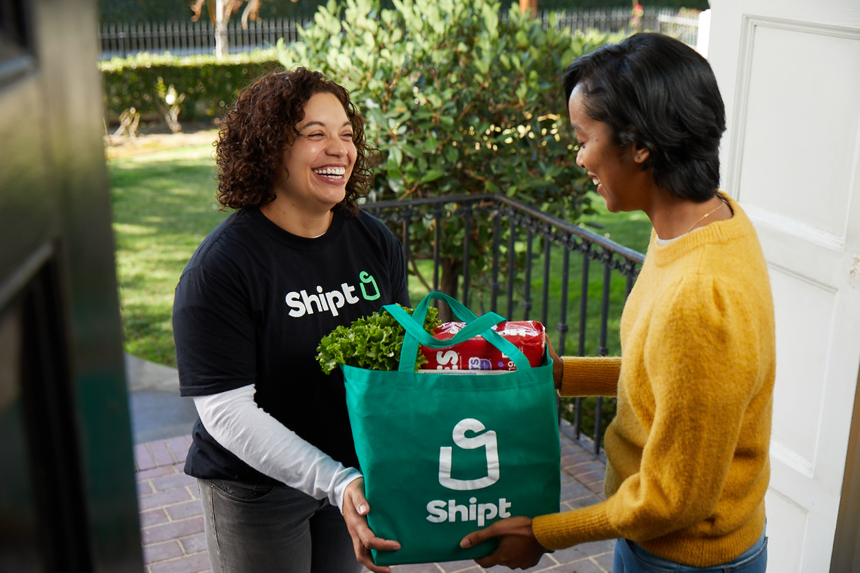 CaringBridge's New Partnership With Shipt Supports Families During Health Journeys 2 shipt delivery woman delivering groceries to another woman