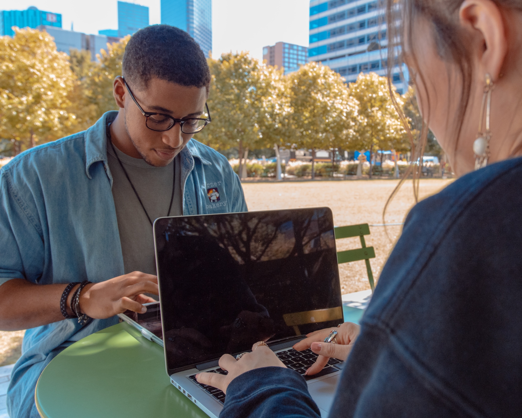 Birmingham Advances in Tech World with Free AI Bootcamp 5 two students sitting across from each other on laptops