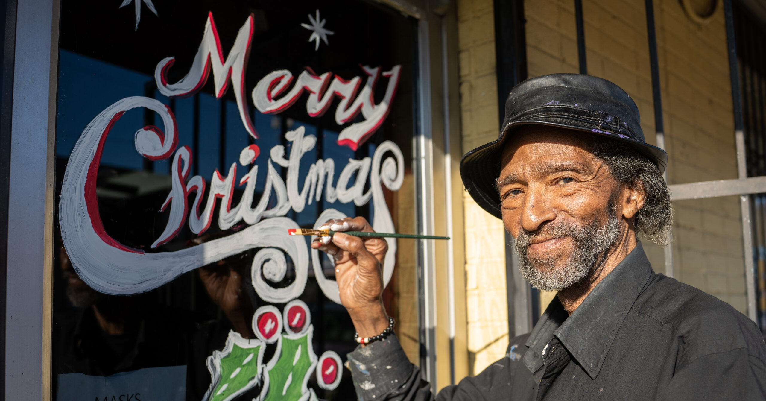 Birmingham artist Java Lewis spreads cheer with holiday window paintings [Photos]