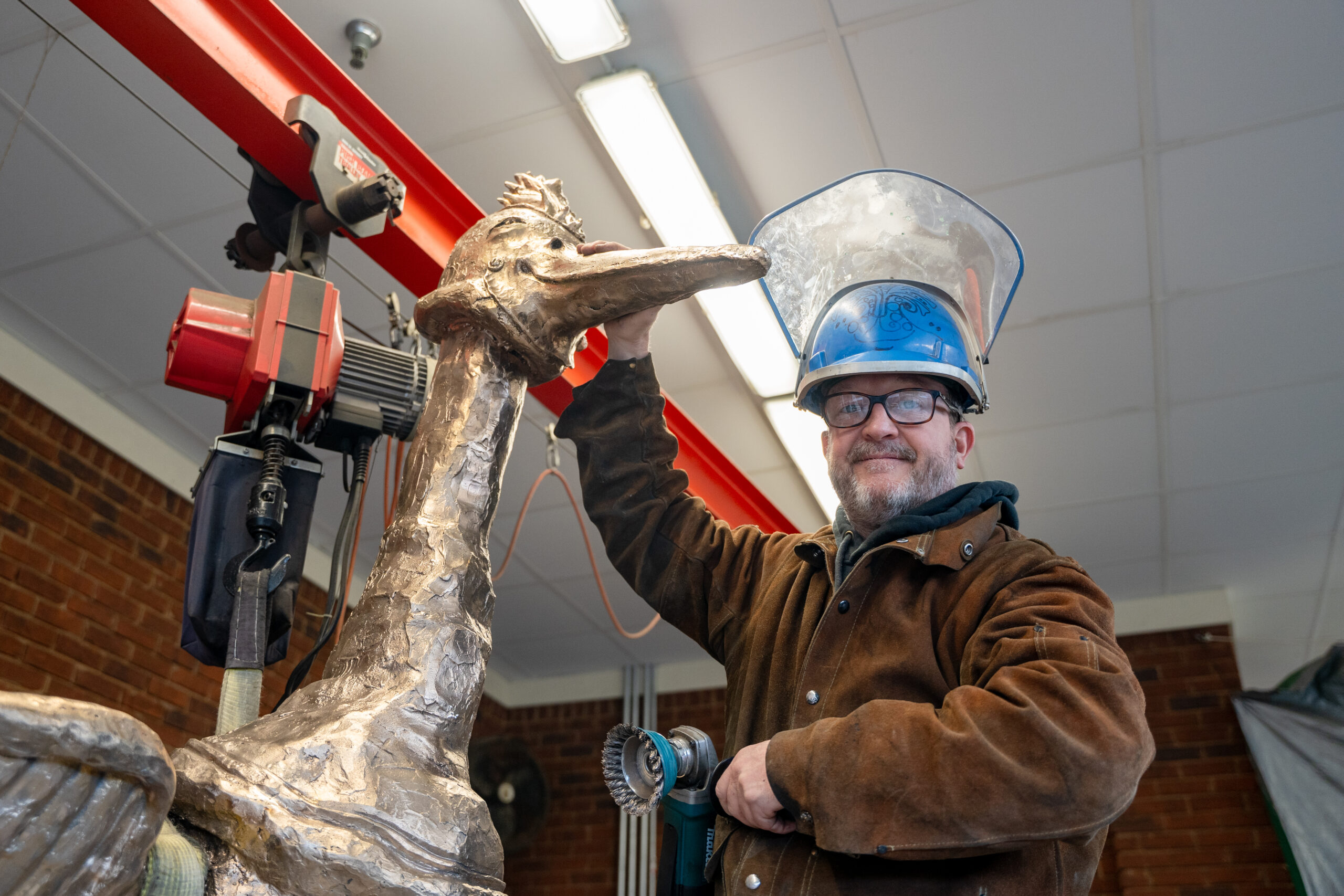Local artist installing new sculpture at Aldridge Gardens, March 2