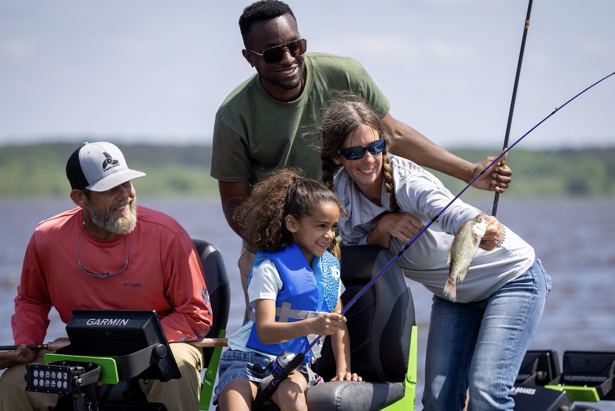 A man, woman and young girl enjoy crappie fishing with a guide on Barnett Reservoir in Ridgeland, Mississippi.