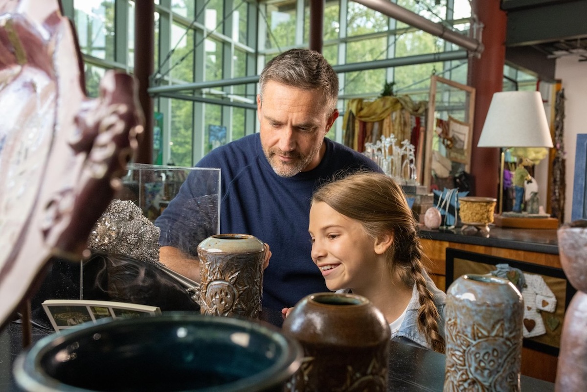 A man and young girl admire pottery at the William “Bill” Waller Craft Center in Ridgeland, Mississippi.